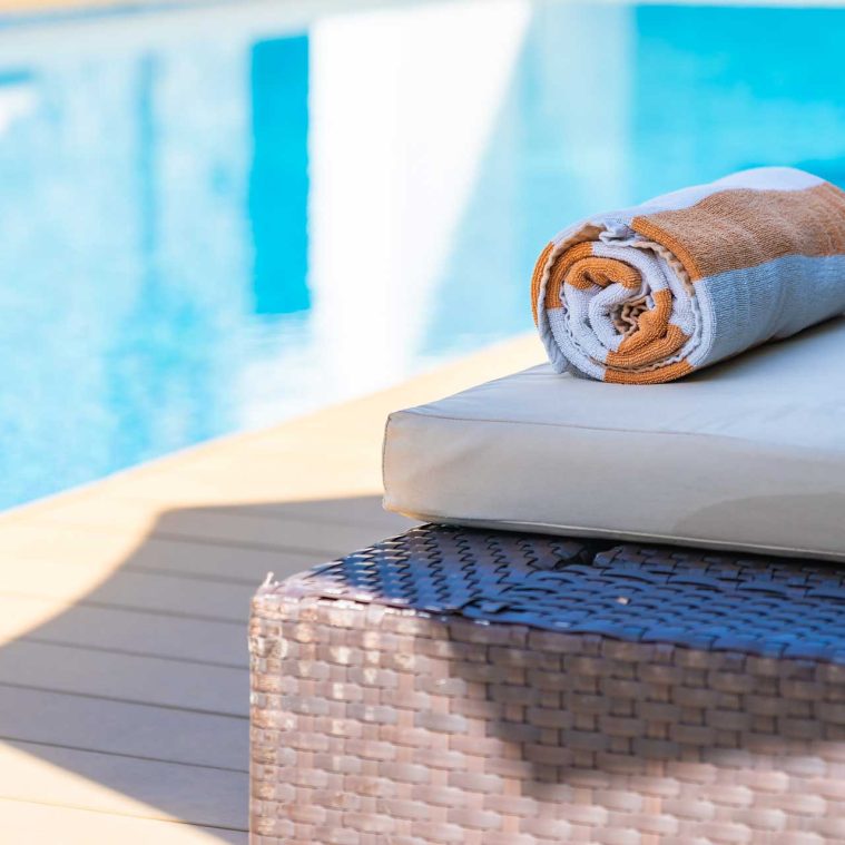 towel-on-bed-around-swimming-pool-in-hotel-resort-2021-08-26-18-11-11-utc